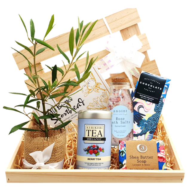 Gift hamper with tree, tea, soap, and other items
