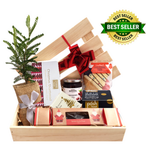 Native Kowhai tree with wooden hamper box and festive food products